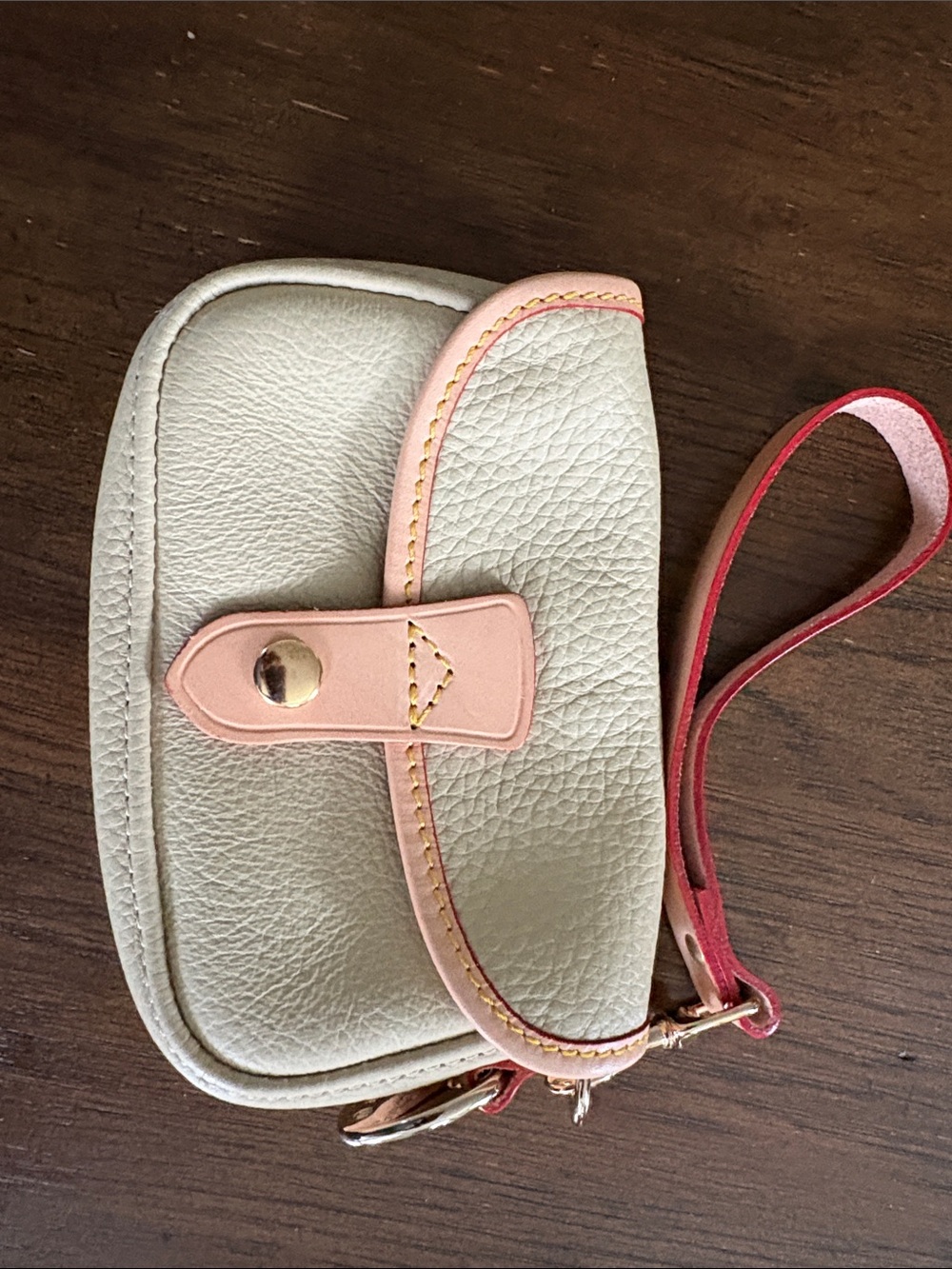 Dooney & Bourke Cream Wristlet with Pink Trim and Red Strap